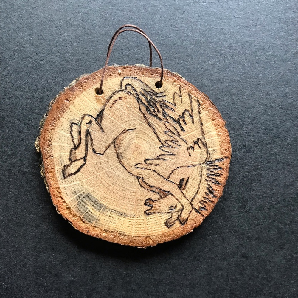 Pegasus pyrogragh on wood slice